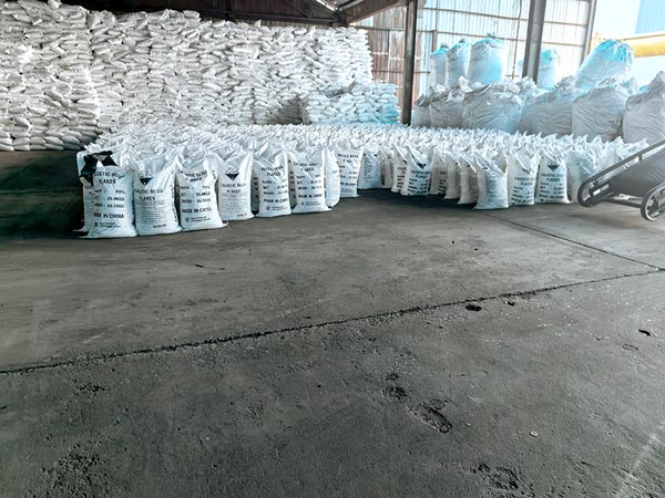 Side profile of multi level pallet racking loaded with high purity caustic soda flakes cargo