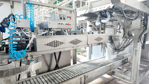 Heavy duty motor and gearbox powering the primary mixer inside caustic soda pearls manufacturing bay