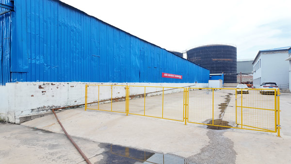 Modern glass and steel facade of the main administrative office building at caustic soda pearls factory