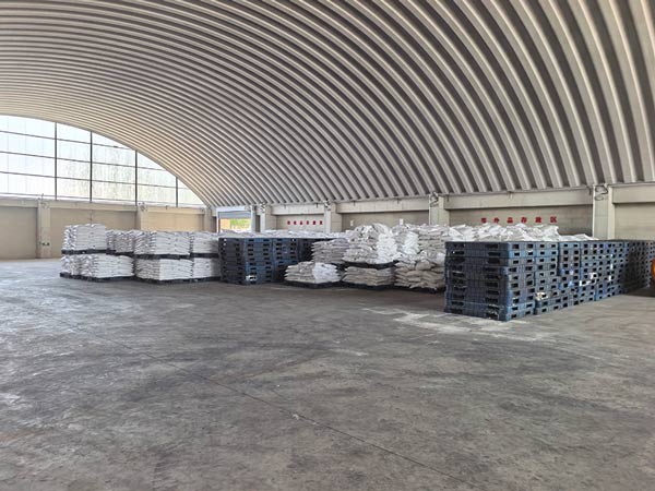 High density block stacking of 25kg lye flakes bags forming a solid cargo wall in depot