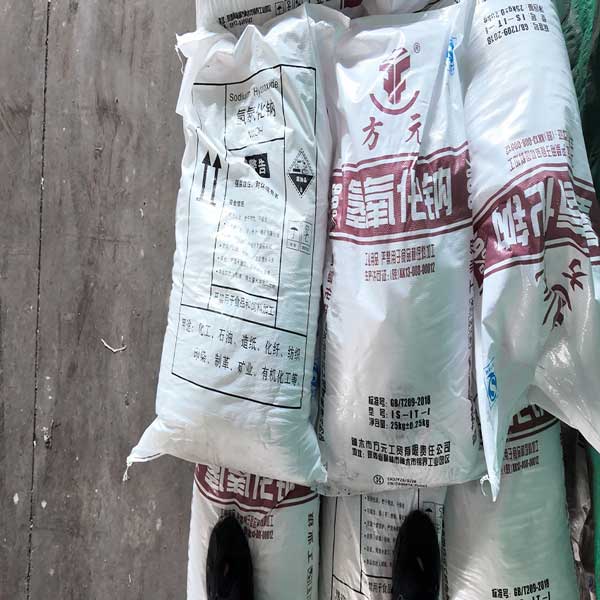 White naoh-solid caustic soda flakes showing high purity crystal texture