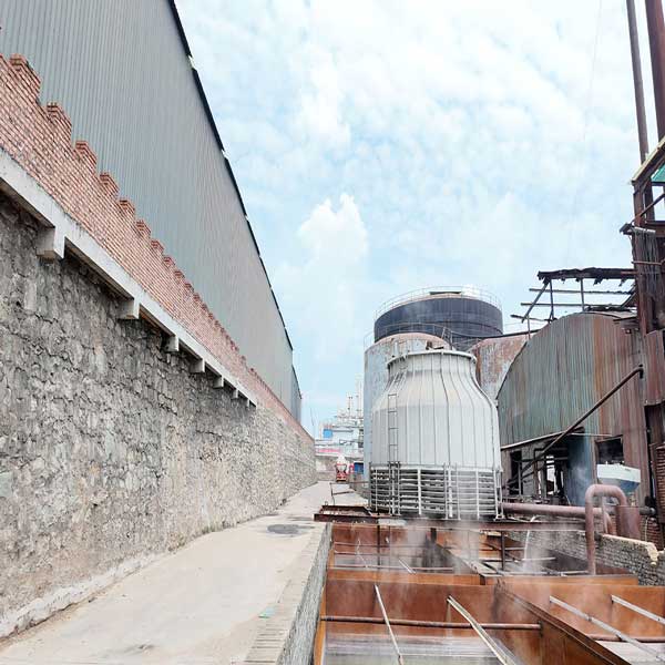Internal view of industrial plant showing specialized equipment for sodium-hydroxide-solid production