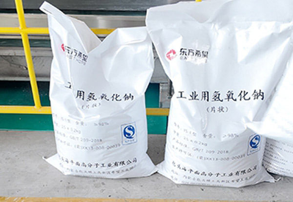 Close up shot of anti-puncture high density woven polypropylene fabric grain on a GACL caustic soda flakes package
