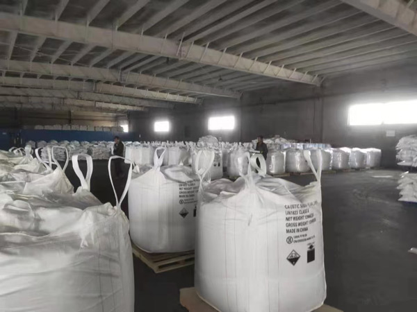 Heavy duty jumbo sacks of acid caustic soda stacked securely on pallets ready for industrial pH adjustment processes.