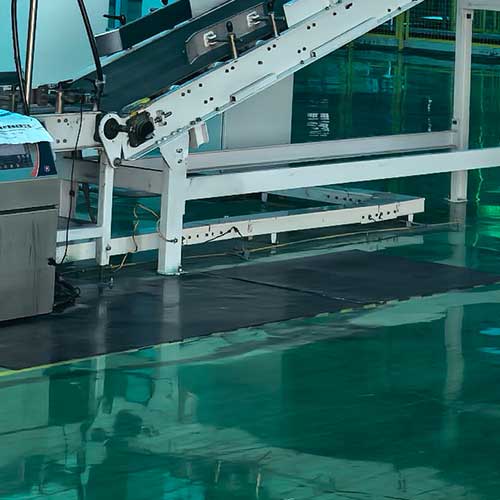 Automated conveyor system and monitoring equipment designed to maintain stable caustic soda liquid price through reduced production costs