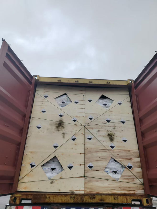 Reinforced wooden bulkhead protection installed inside a container to secure ocean freight caustic soda market supply