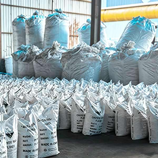 Offset row interlocking tier formation applied to stacked caustic soda product bags inside plant staging bay