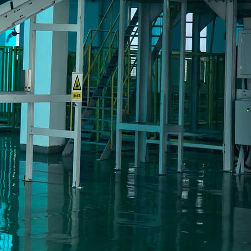 Conveyor belt structure in a clean chemical plant facility, illustrating safe and efficient product flow