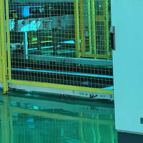 Bulk material storage area in a chemical manufacturing plant focused on clean standards and safety.