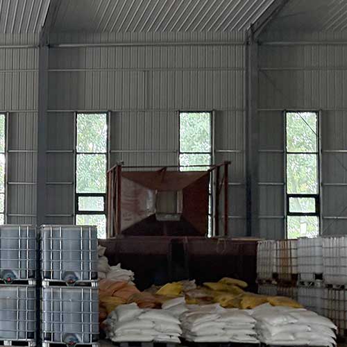 High purity bulk sodium hydroxide chemical storage in modern manufacturing facility