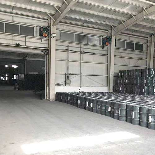 Sodium hydroxide sodium hypochlorite liquid stored in steel drums in factory warehouse
