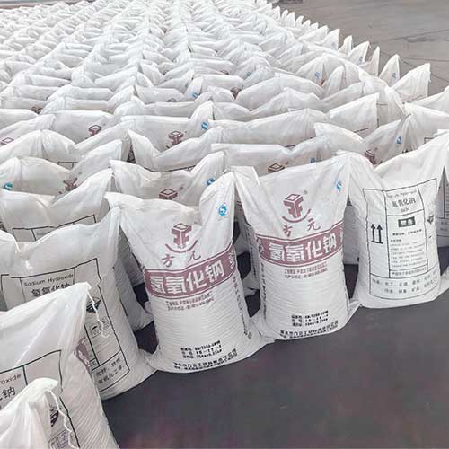 Warehouse stock of sodium hydroxide for cleaning formulations, displaying neatly arranged bags prepared for global export.