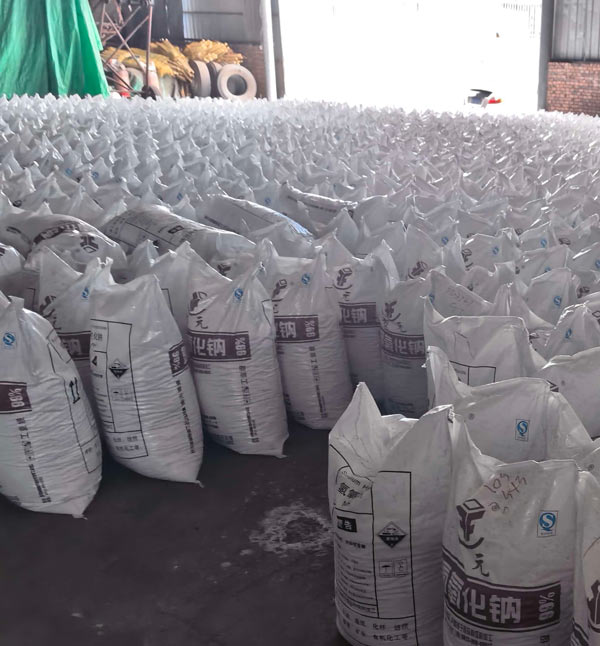 Large warehouse inventory of sodium hydroxide bags available at competitive caustic soda online price for industrial buyers.