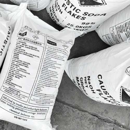 Premium-quality, high-purity Sodium Hydroxide (Caustic Soda) flakes, with a guaranteed 99% NaOH assay, packaged in a robust 25.0KGS industrial woven plastic bag for efficient handling.