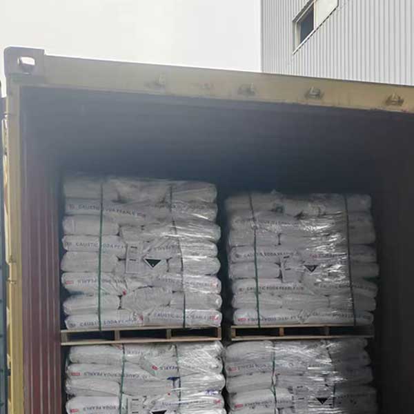 Shipping container loaded with palleted 25kg bags of Caustic Soda Pearls NaOH for export shipment