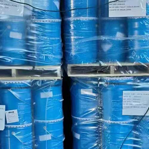 Palletized blue drum inventory stored in a factory warehouse, offering reliable supply for sodium hydroxide beads buyers.
