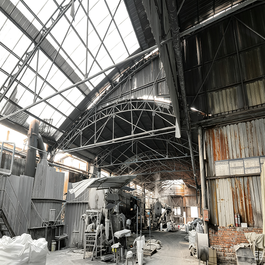 High-capacity chemical manufacturing plant equipped with heavy reactors, providing a highly competitive sodium hydroxide bulk price.