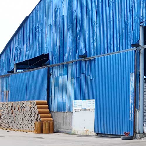Industrial loader and transport equipment staged in a chemical yard for caustic soda solution logistics.