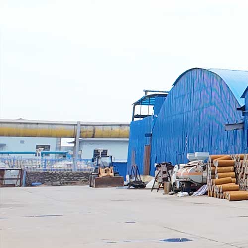 Heavy-duty equipment and facility infrastructure supporting bulk liquid sodium hydroxide orders.