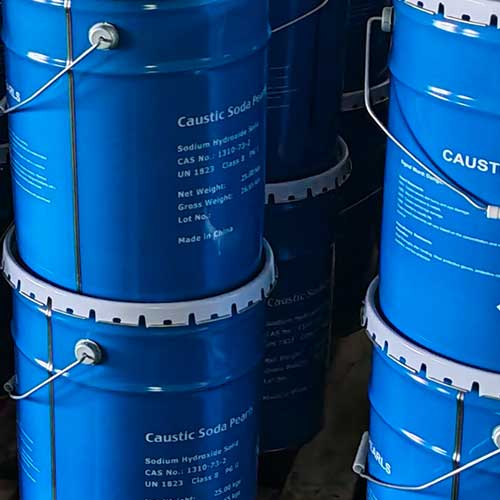 Heavy-duty chemical containers filled with free-flowing spherical pels caustic soda beads for dosing systems.