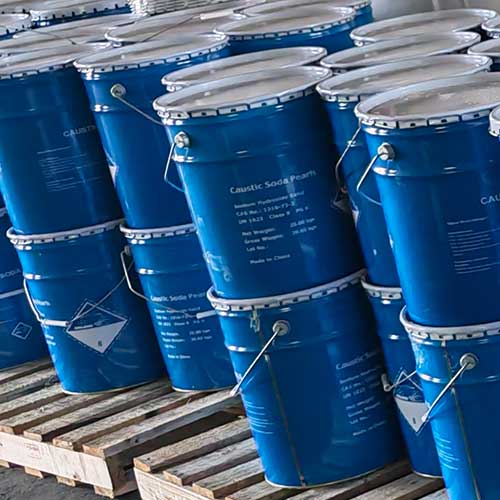 Heavy-duty blue metal drums with tight white lids engineered to keep soda beads completely dry and moisture-free.