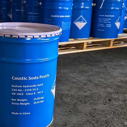 Export-standard blue metal pail filled with 99% pure soda with beads ready for worldwide distribution.
