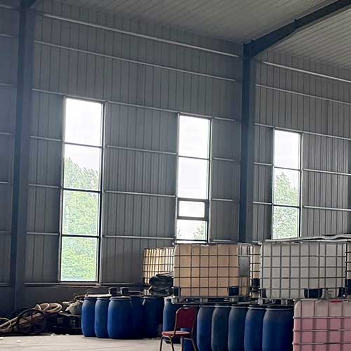 High-ceiling chemical storage facility housing wholesale inventory of caustic 30 solution.