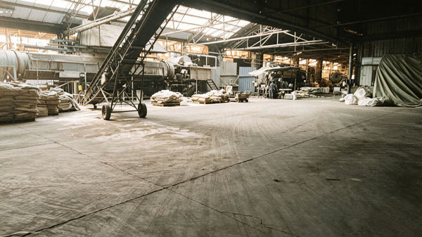 industrial material loading station featuring inclined conveyor line for caustic soda flakes price in china