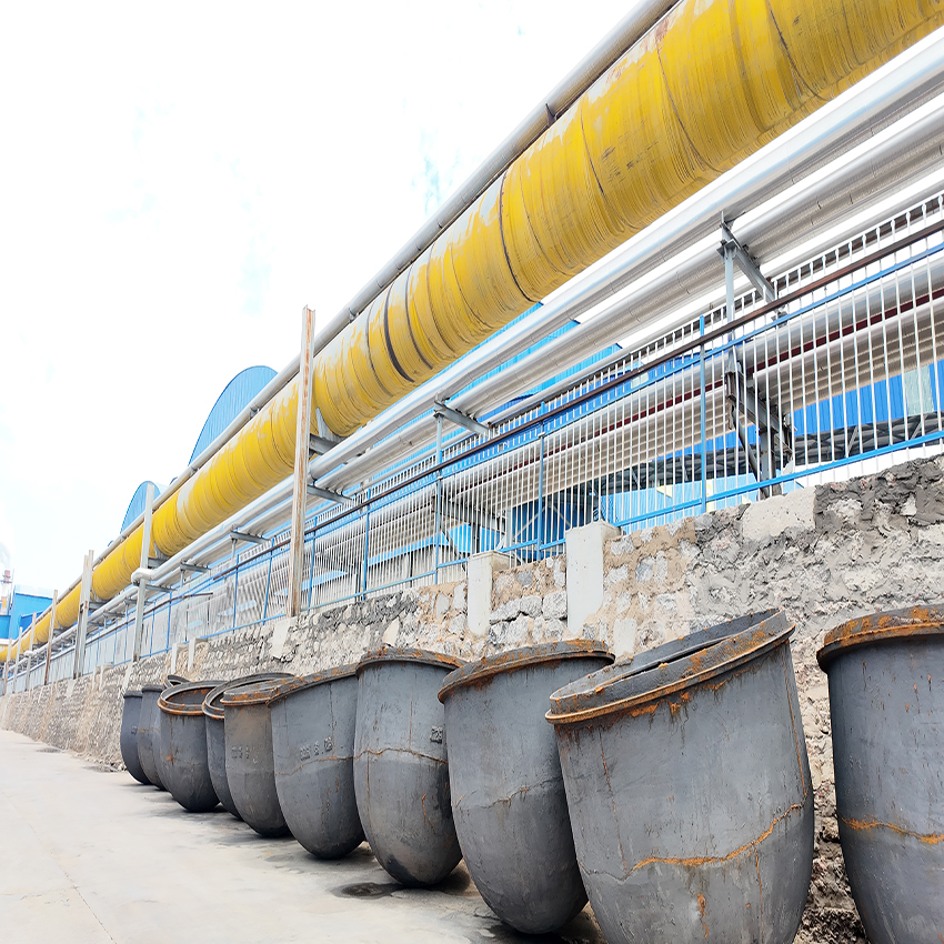 Overhead chemical pipeline system transporting high-purity caustic soda solution 50 across the plant.